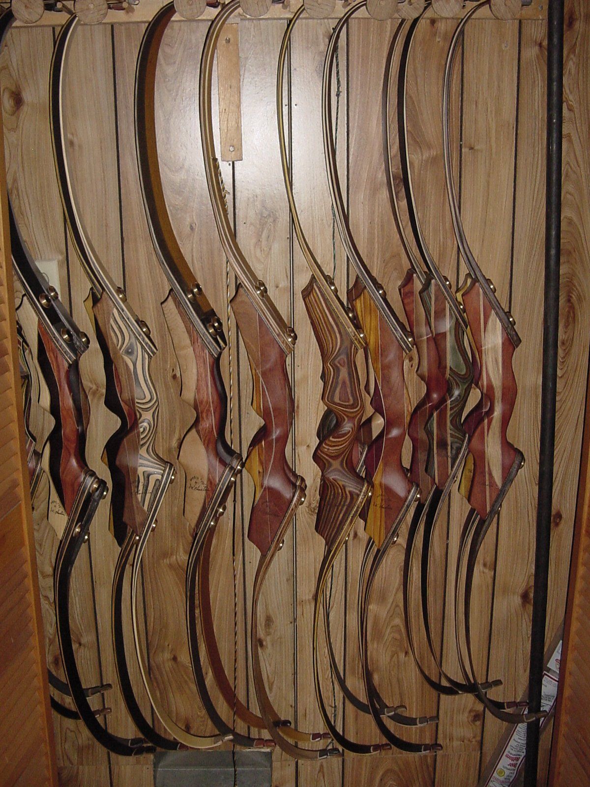 Finished Wapiti bows hanging in the workshop